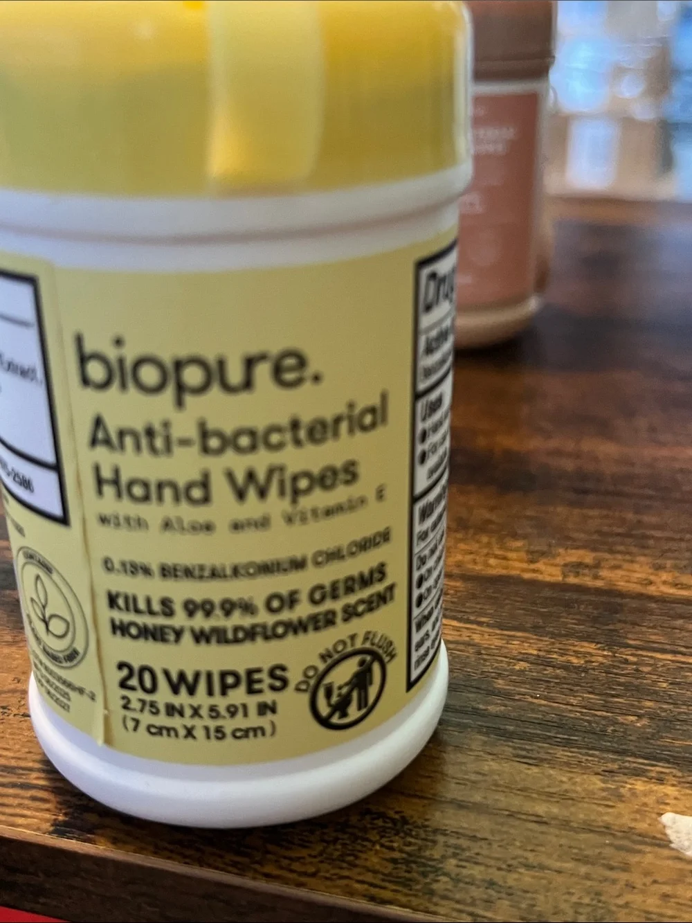 Biopure Anti-bacterial Hand Wipes in pop top plastic container with a clip